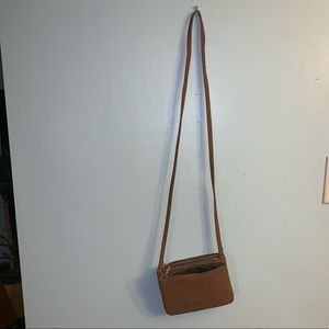 Three pocket faux leather bag